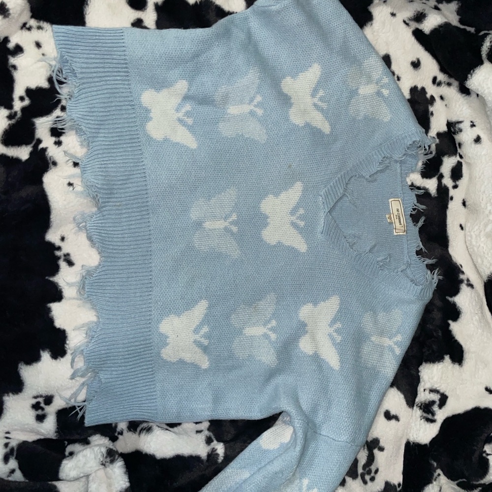 Blue and White V-Neck Sweater with Butterfly Pattern